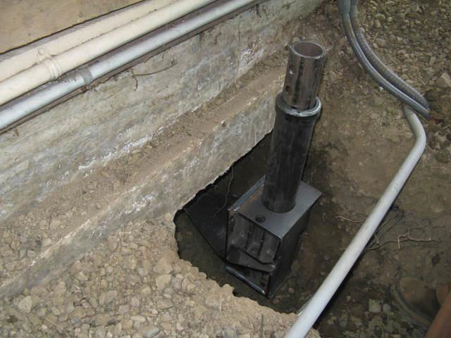 ODOT Foundation Repair - Helical Piers in Myrtle Creek, OR Helical pier and bracket positioned beneath the ODOT scale shack foundation