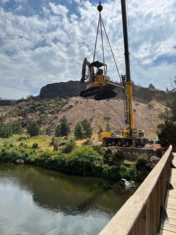 excavator being lifted by crane smith rock smith