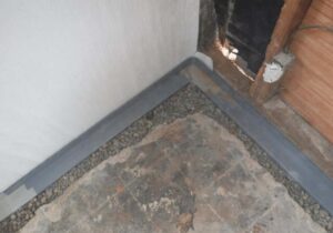 Waterguard was installed around the perimeter of the basement. Waterguard