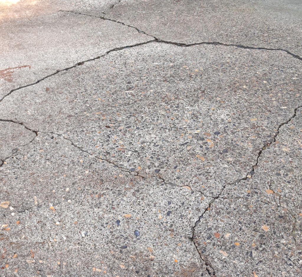 cracked concrete sidewalk