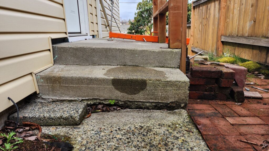 uneven cracked concrete stair tripping hazard Concrete